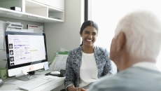 A provider having a conversation with an older patient.