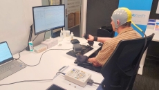 A post-stroke patient receiving brain-computer interface-based rehabilitation therapy A post-stroke patient receiving brain-computer interface-based rehabilitation therapy