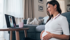 Pregnant women consulting with a healthcare professional via laptop computer Pregnant women consulting with a healthcare professional via laptop computer