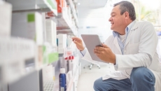 Pharmacist checking inventory Pharmacist checking inventory