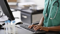 Nurse working at a computer Nurse working at a computer