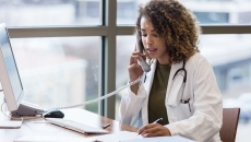 Healthcare professional talking on the telephone Healthcare professional talking on the telephone