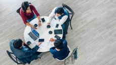 People having a business meeting at a roundtable People having a business meeting at a roundtable