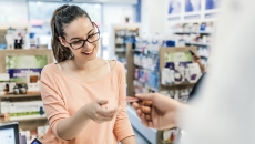 Woman interacting with a pharmacist Woman interacting with a pharmacist