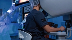 A surgeon operating using robotic technology A surgeon operating using robotic technology