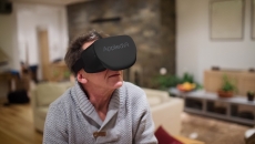 A man using an AppliedVR headset at home. A man using an AppliedVR headset at home.