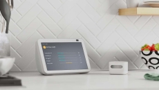 Amazon's air quality monitor next to an Alexa device displaying quality metrics