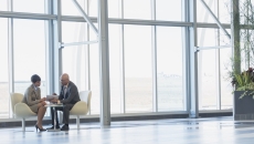 Two executives conferring Two executives conferring