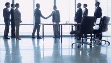 Executives discussing business deal Executives discussing business deal