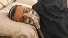 Man with CPAP mask Man with CPAP mask