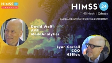 David Wolf at MedeAnalytics and Lynn Carroll at HSBlox_Palm trees and skyscrapers in Orlando Photo by Gabriele Maltinti/iStock/Getty Images Plus