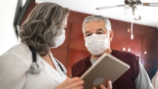 Healthcare provider and patient talking to each other Healthcare provider and patient talking to each other