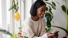 Person looking at data on a cell phone Person looking at data on a cell phone