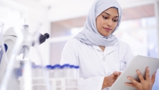 Researcher looking at an iPad Researcher looking at an iPad