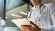 Healthcare provider holding a tablet Healthcare provider holding a tablet