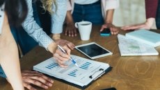 people looking at tablet, papers people looking at tablet, papers