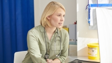 Healthcare provider sitting in a room Healthcare provider sitting in a room