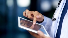 Healthcare provider on a tablet Healthcare provider on a tablet