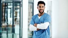 Person standing with arms crossed Person standing with arms crossed