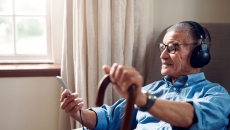 man in chair with cane man in chair with cane