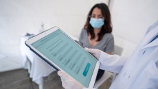 Patient and provider examine digital health metrics Patient and provider examine digital health metrics