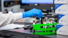 A pathologist handling blood samples in a Guardant Health lab