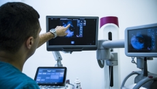 Technician looking at x-ray Technician looking at x-ray