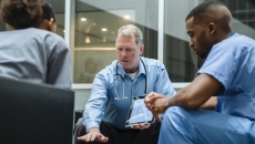 Physicians reviewing data Physicians reviewing data