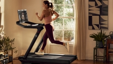 A person running on a Peloton treadmill A person running on a Peloton treadmill