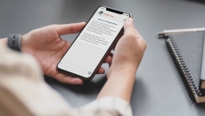 A person using the ThoughtFullChat mobile app