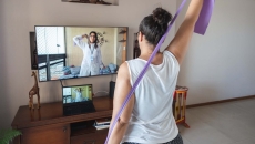 A woman doing at-home physical therapy exercises A woman doing at-home physical therapy exercises
