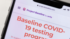 A phone showing a screenshot from Project Baseline's COVID-19 testing program. A phone showing a screenshot from Project Baseline's COVID-19 testing program.