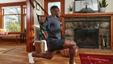 employee working out at home with the TRX for Employee Wellbeing program