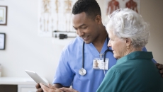 Nurse consulting with patient Nurse consulting with patient
