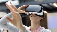 Person wearing a virtual reality headset Person wearing a virtual reality headset