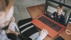 Healthcare professional interacting with a patient via telehealth platform