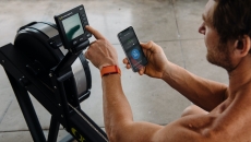 WHOOP user checking app before rowing workout