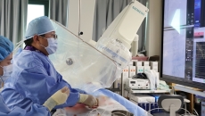 A surgeon conducting a stent procedure A surgeon conducting a stent procedure