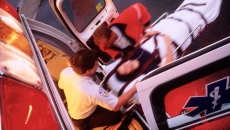 Paramedics rolling a patient onto an ambulance. Paramedics rolling a patient onto an ambulance.