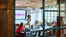 A woman presenting to potential investors A woman presenting to potential investors
