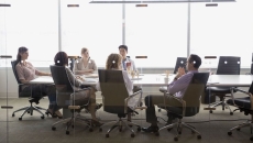 Executives at a conference table Executives at a conference table