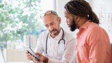 A man talking to his primary care provider A man talking to his primary care provider