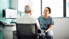 A doctor talking with a patient. A doctor talking with a patient.