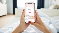 A close up of a woman using the Flo app A close up of a woman using the Flo app