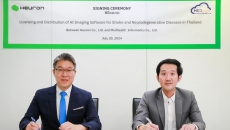 Heuron and Medhealth Informatics representatives during a distribution deal signing Heuron and Medhealth Informatics representatives during a distribution deal signing
