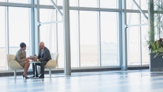 Two professionals meeting in an office. Two professionals meeting in an office.