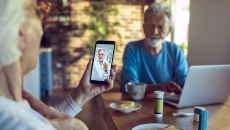 An older couple talking to a doctor via telehealth An older couple talking to a doctor via telehealth