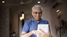 An older man using a tablet An older man using a tablet