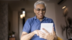 An older man using a tablet An older man using a tablet