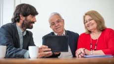 An agent discussing insurance packages with prospective clients